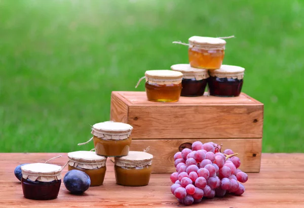 Appetizing sweet jars with honey and jam from natural home ingredients — Stock Photo, Image
