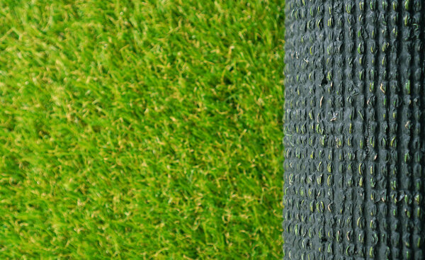 Artificial grass rolling. Background wtih copy space.