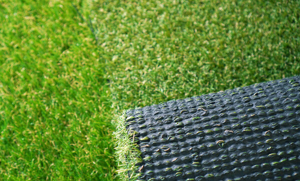 Roll of an artificial grass. Landscape greenering with artificial turf.