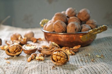 Walnuts. Composition with wallnuts on the sackcloth. Nuts on the table. 