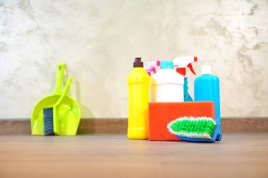 Household chemicals for cleaning service standing on the floor
