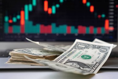 Exchange loss concept with one dollar bills stack and graph on a backdrop