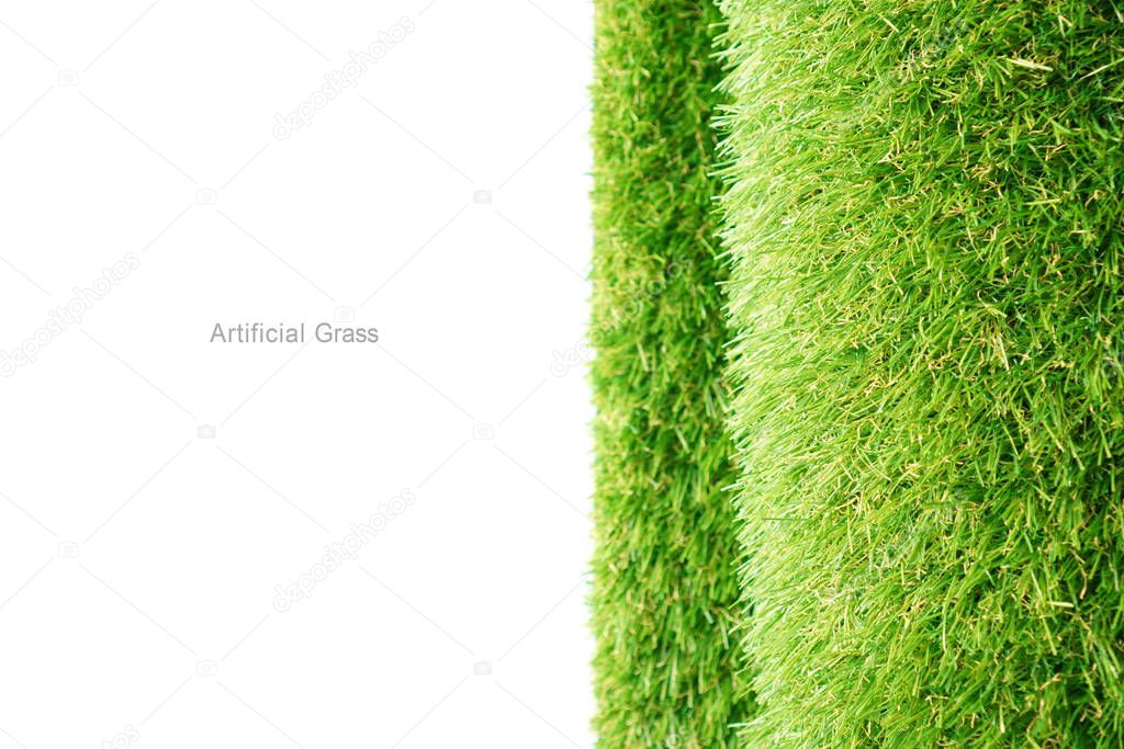 Roll of green artificial grass on a white background with empty place for your text