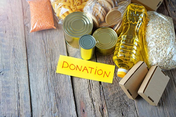 Donación de antecedentes alimentarios con productos y texto Donación — Foto de Stock
