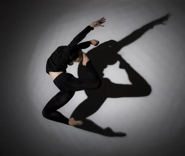 Gymnastic jump girls and the shadow of it. — Stock Photo, Image