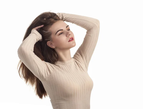 Emotions of beautiful girl in a beige dress. — Stock Photo, Image