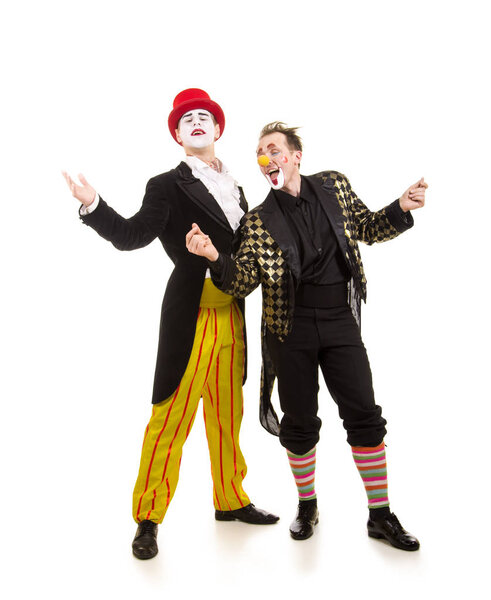 Two happy clowns with a funny expression.