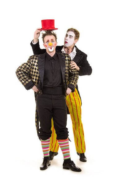 Two happy clowns with a funny expression.