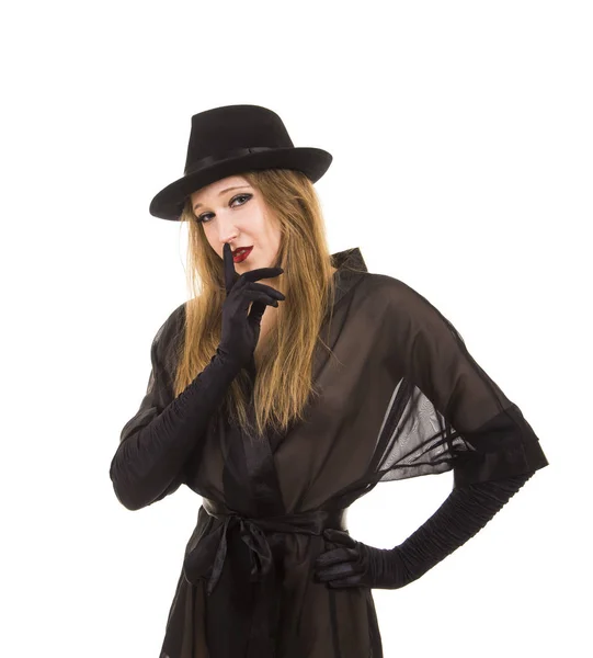 Vacker ung flicka i svart tunika, svart hatt och svarta handskar. — Stockfoto