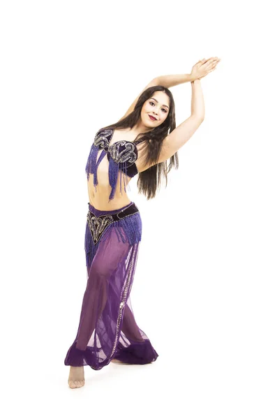 Attractive brunette girl with long hair dancing belly dance. — Stock Photo, Image