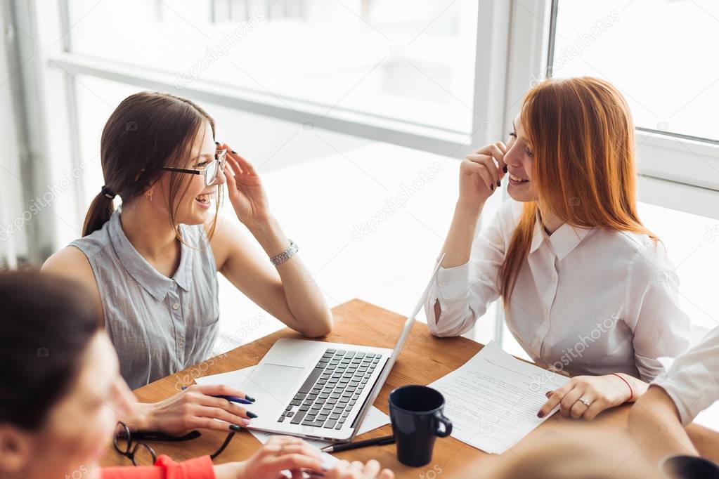 Image of business partners discussing documents and ideas at meeting