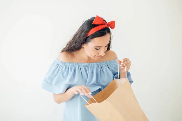 Portrait beautiful happy surprised woman girl holding in her hands shopping bag — Stock Photo, Image