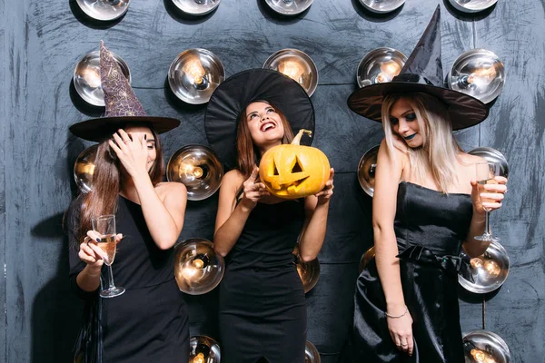 In good moods at halloween party. womans with pumpkins — Stock Photo, Image