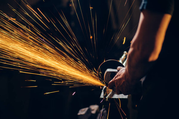 crop photo of Industrial Grinder Metal Grinder throwing sparks