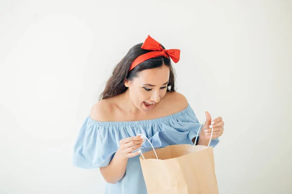 Portrait beautiful happy surprised woman girl holding in her hands shopping bag — Stock Photo, Image