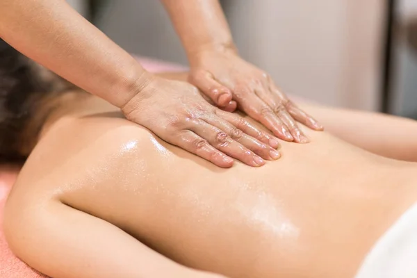 Woman Having Massage With Massage Oil In A Spa