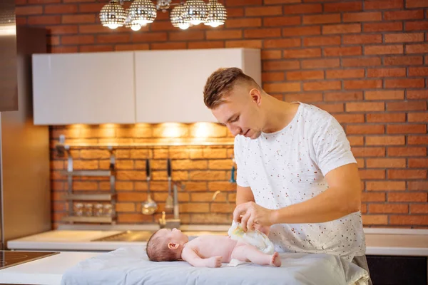 Father is changing nappy to his baby boy — Stock Photo, Image
