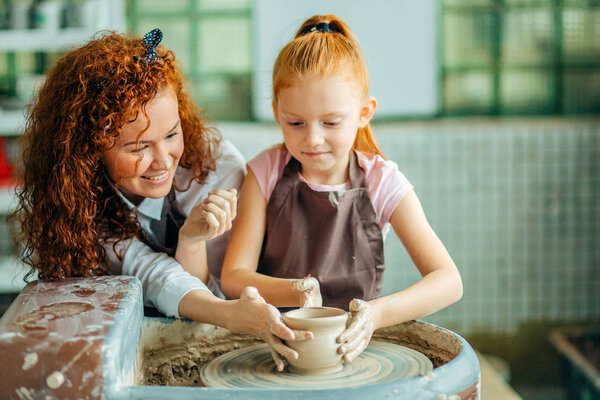 redhead sisters make a pitcher of a pottery wheel