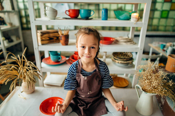 girls in studio are made of many ceramic cups