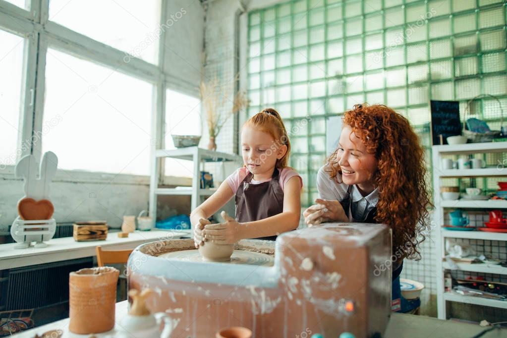 redhead sisters make a pitcher of a pottery wheel