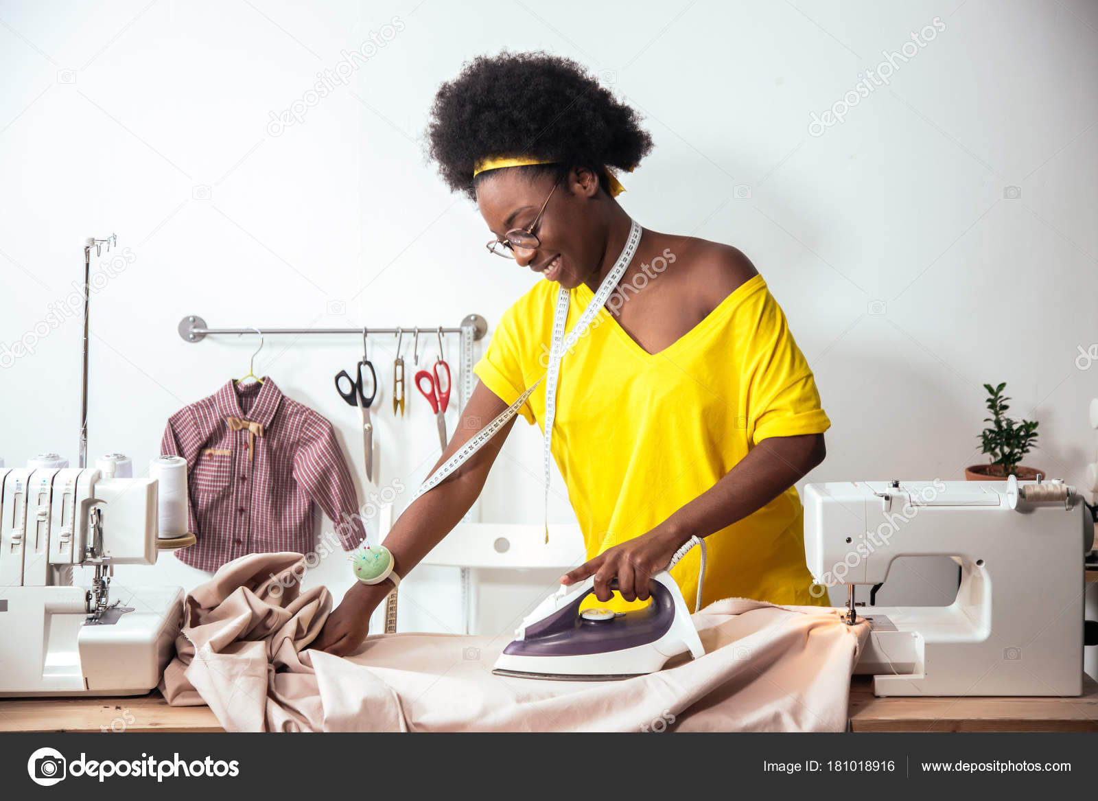 African Woman seamstress Ironing cloth Stock Photo by ©ufabizphoto 181991862