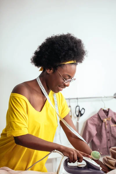 African Woman seamstress Ironing cloth — Stok Foto