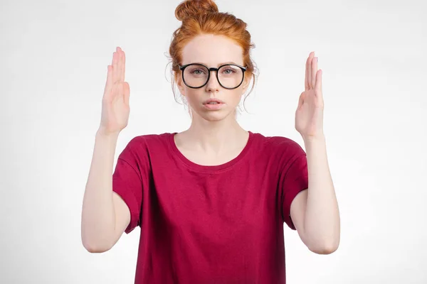 Woman making frame with hands on right and left on white background — Stock Photo, Image