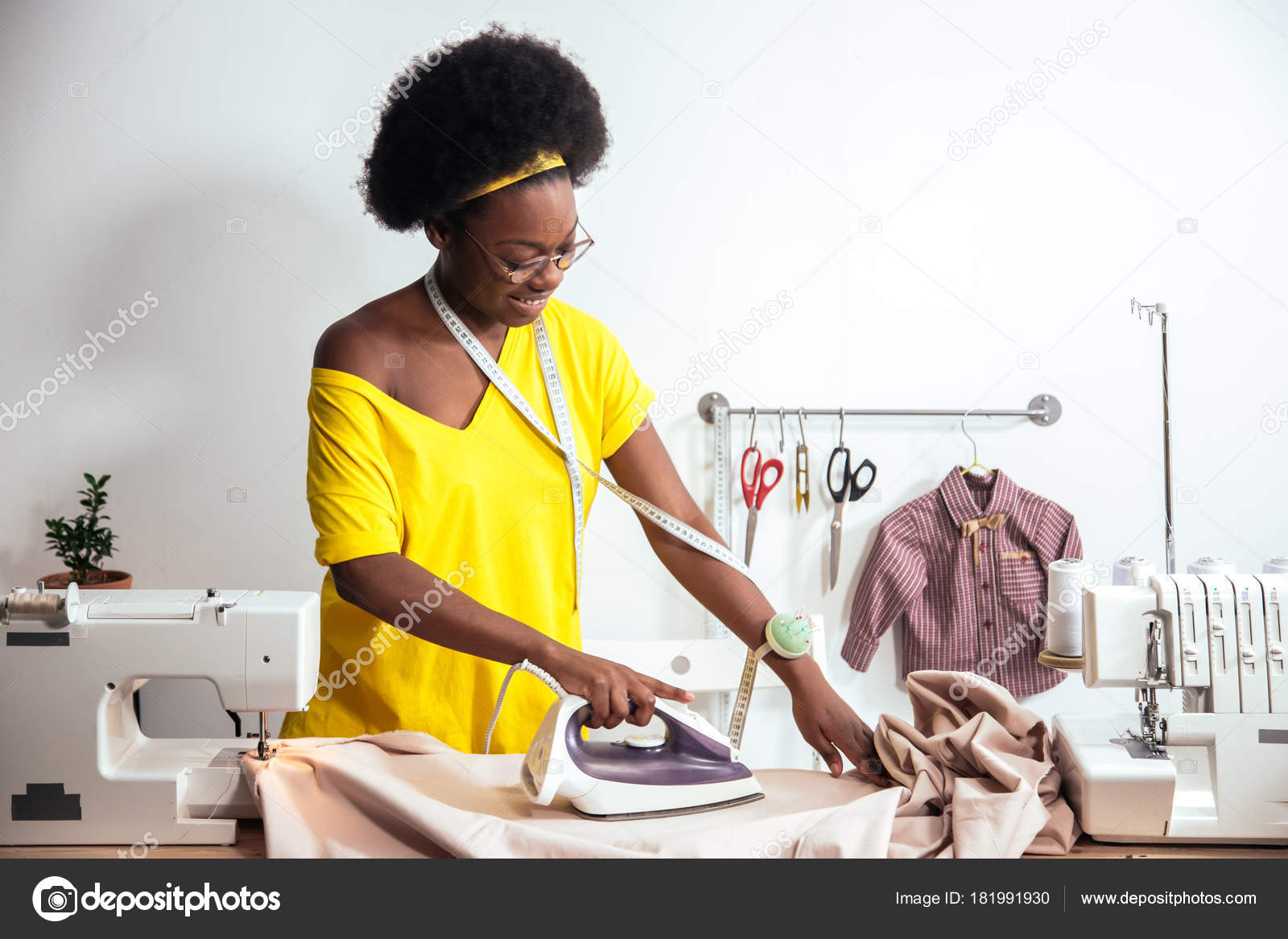 African Woman seamstress Ironing cloth Stock Photo by ©ufabizphoto 181991862