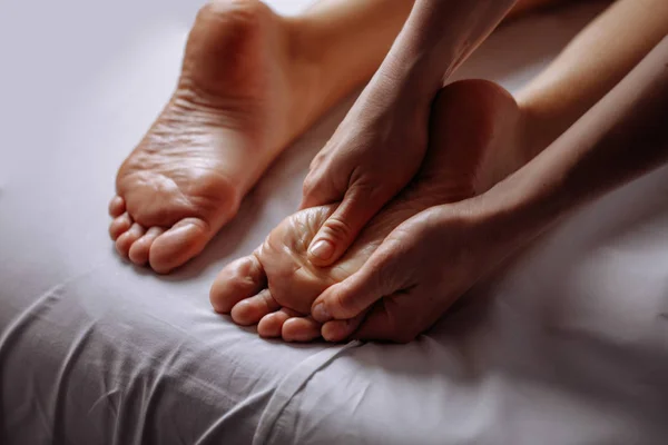 Woman having feet massage in beauty salon, close up view — Stock Photo, Image