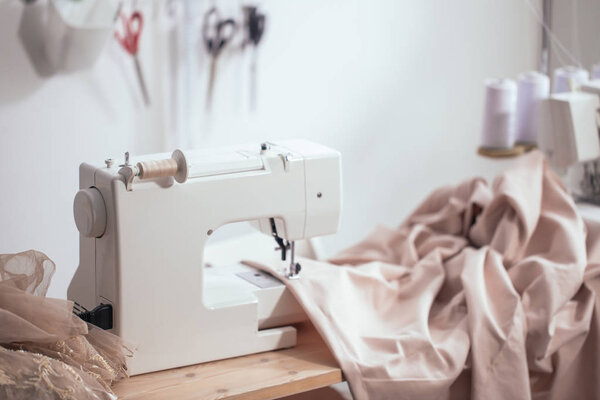 Sewing machine on table in workshop
