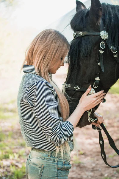 Long hair young woman with a horse outdoor — Stock Photo, Image