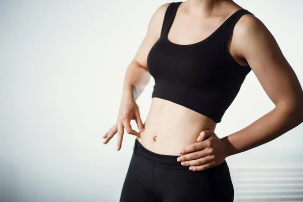Closeup Of Female Hand Pinching Fit Pumped Belly — Stock Photo, Image