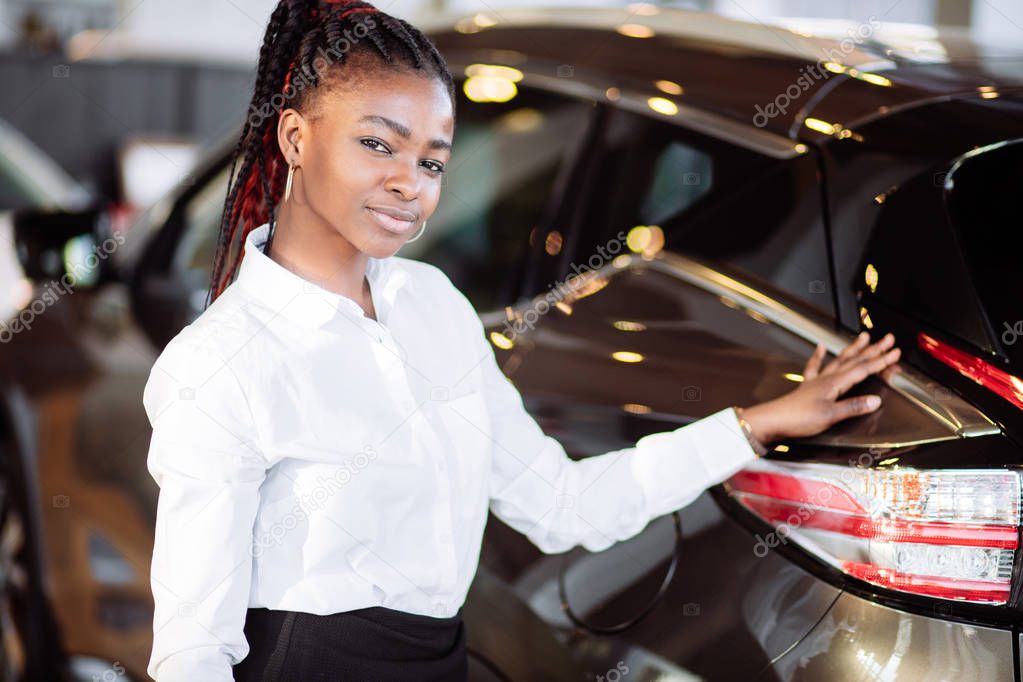 Car dealer woman. Auto dealership and rental concept