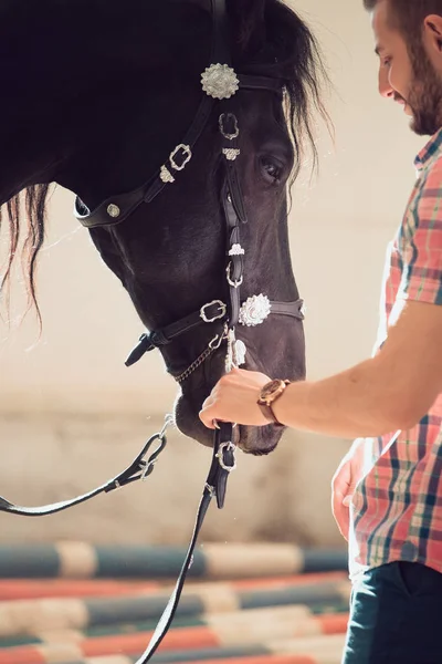 Young man with horse. Autumn outdoors scene — Stock Photo, Image