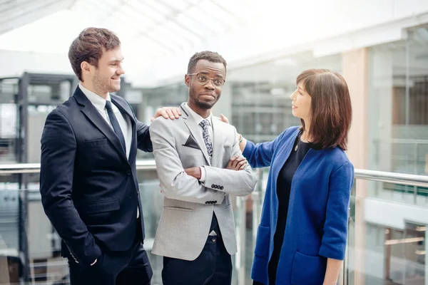 Multiracial Business Team congratulate For Success Of afroamerican Colleague