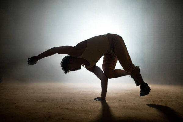 practitioner of dance doing specific moves of hip hop