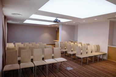 light conference room with blue walls and chairs on hire clipart
