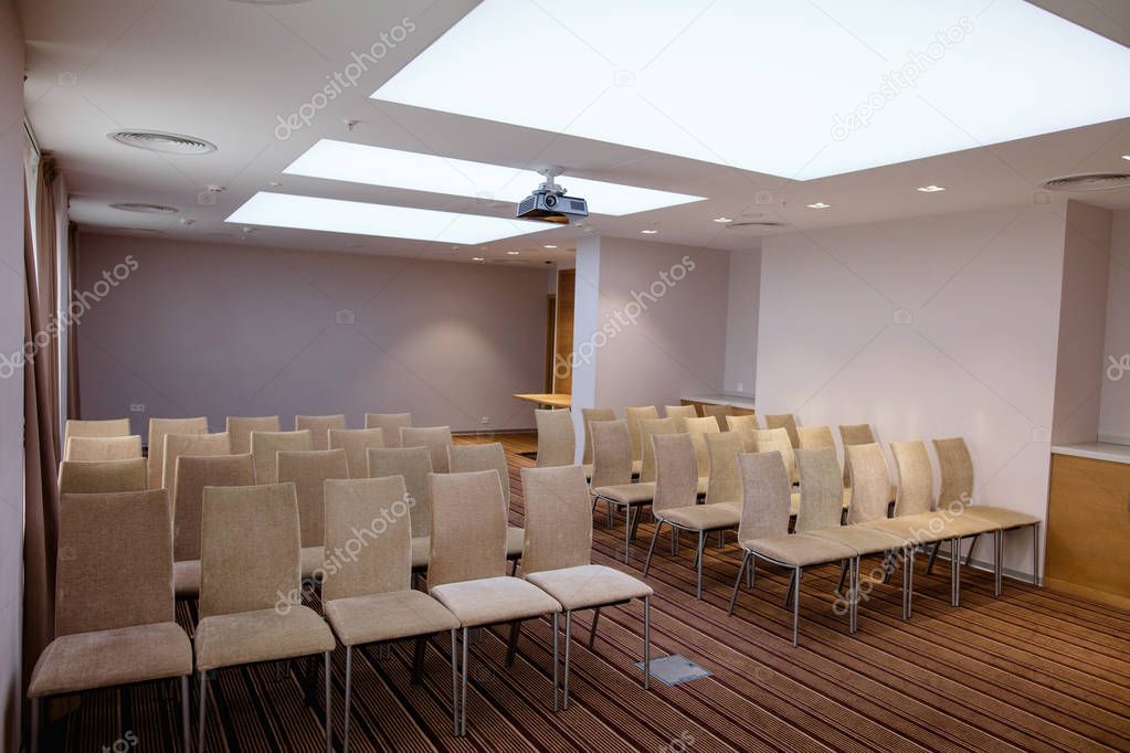 light conference room with blue walls and chairs on hire