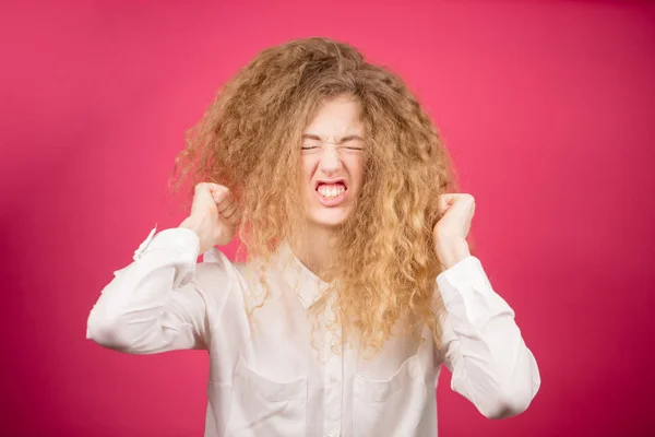 Aggressive lady with curly long hair made crazy hairstyle — Stock Photo, Image