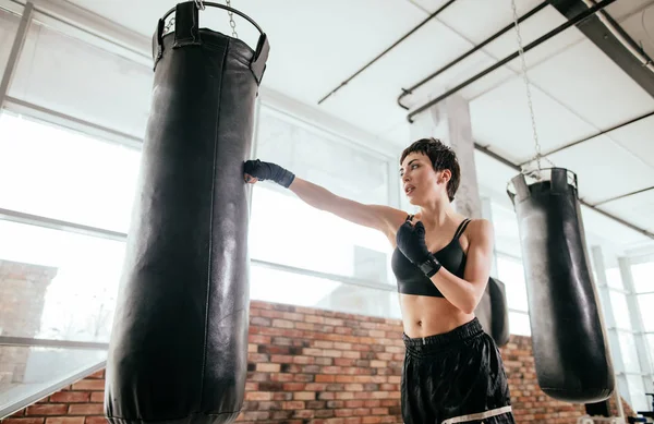 woman in sportswear is getting the exercises to participate in match