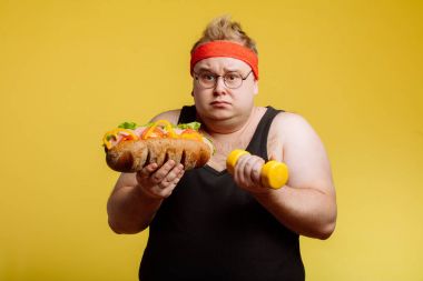 Fat man choise between sport and fastfood clipart