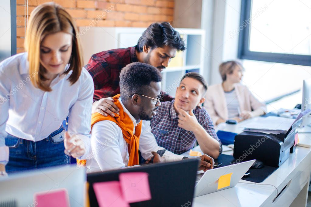 closeup cropped image of Indian man teaching students to work with program