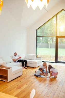 Family relaxing in holiday at home