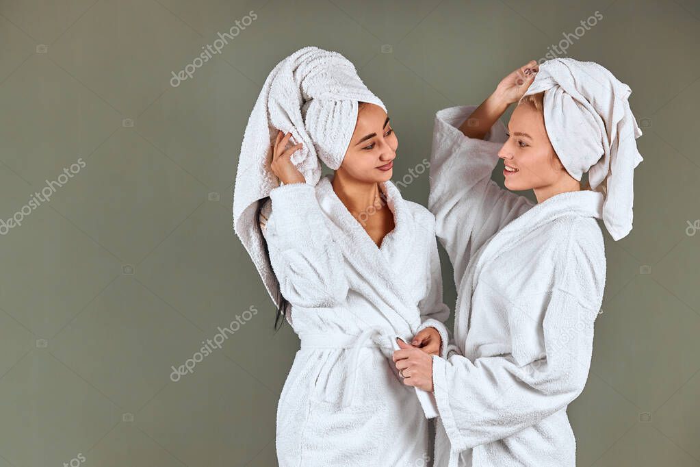 Portrait of two beautiful women in bathrobe