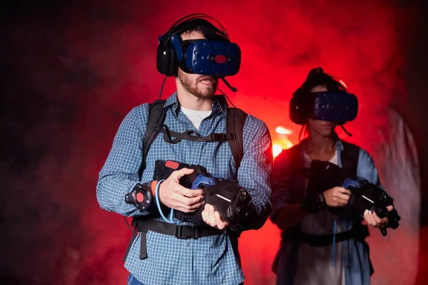 Couple playing game using virtual reality headset