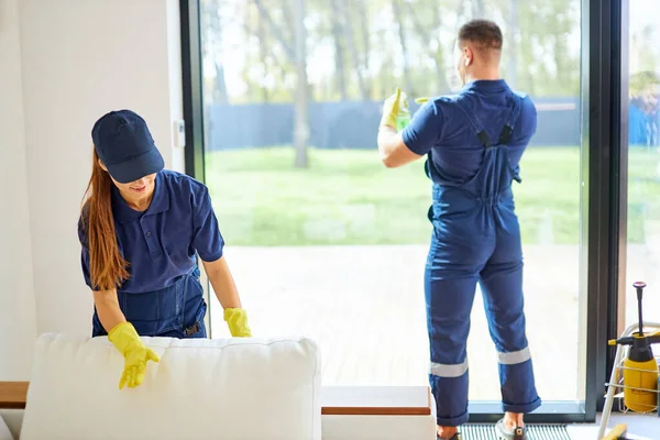 Cleaning service team working in room with big window — Stock Photo, Image