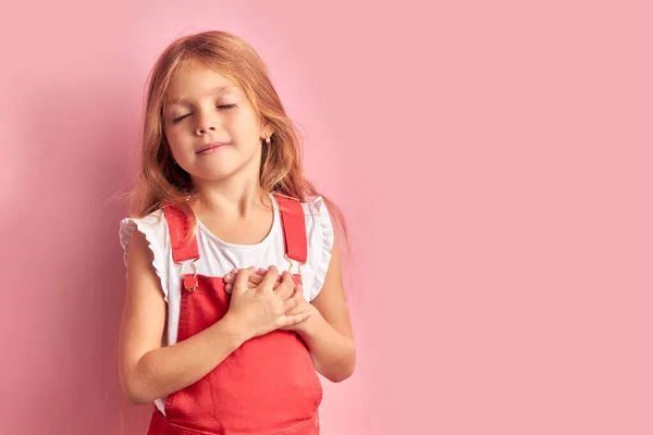 Cute little girl kid posing look at camera isolated — Stockfoto