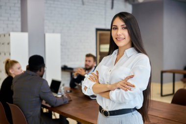 Confident business lady posing in office, look at camera