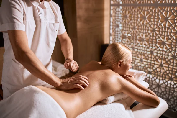Blonde woman having aroma oil massage — Stock Photo, Image