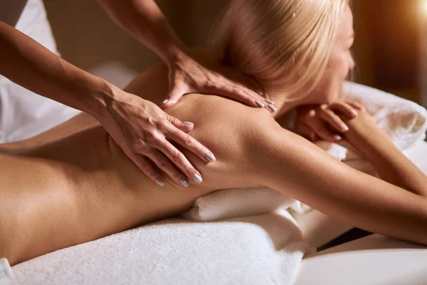 Woman having massage in modern wellness center — Stock Photo, Image